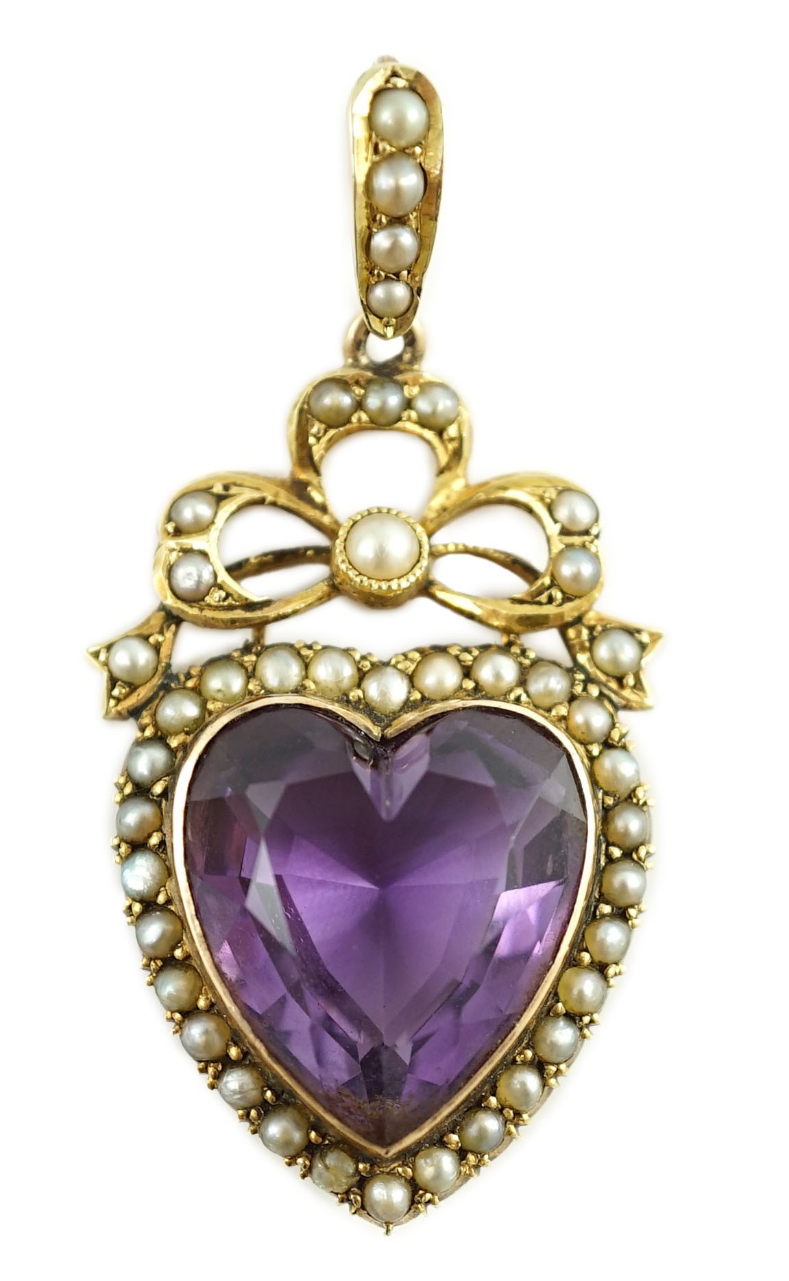 A late Victorian gold, heart shaped amethyst and seed pearl set drop pendant